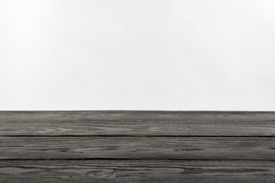 Photo of Empty grey wooden surface on white background. Space for text