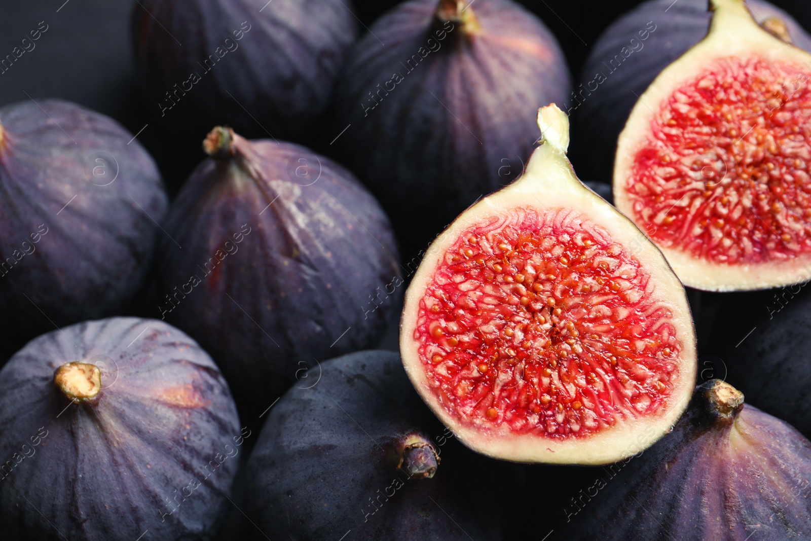 Photo of Fresh ripe figs as background, top view. Tropical fruit