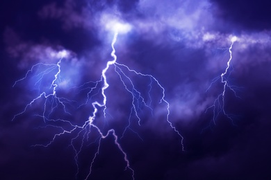 Image of Lightnings in dark cloudy sky during thunderstorm