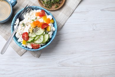 Photo of Delicious cottage cheese with vegetables and chia seeds served on white wooden table, flat lay. Space for text