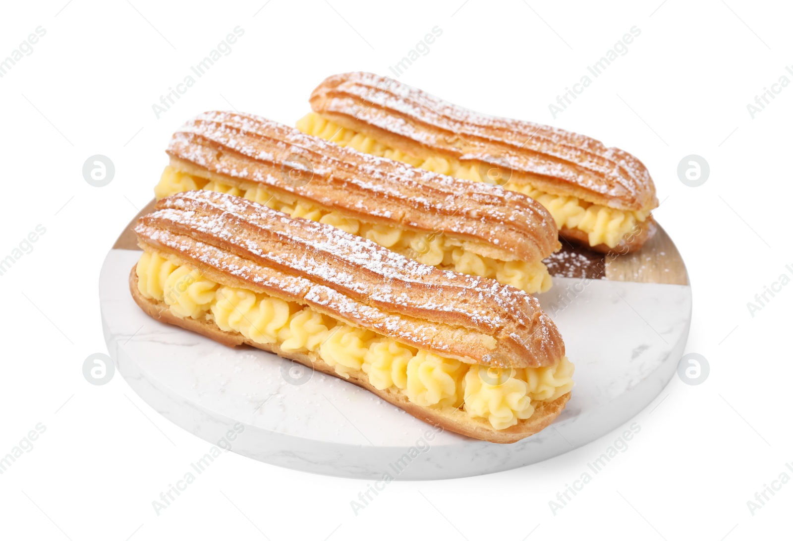 Photo of Delicious eclairs filled with cream isolated on white