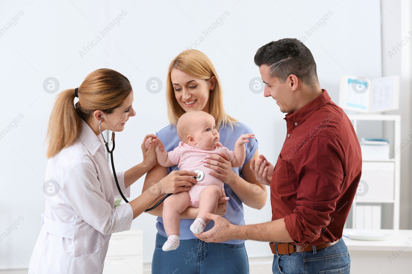 Photo of Parents with their baby visiting children's doctor in hospital