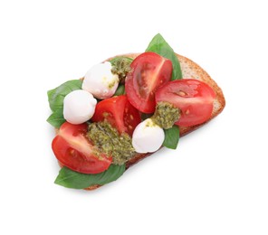 Photo of Delicious Caprese sandwich with mozzarella, tomatoes, basil and pesto sauce isolated on white, top view