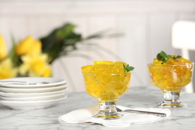 Dessert bowls of jelly served on table. Space for text