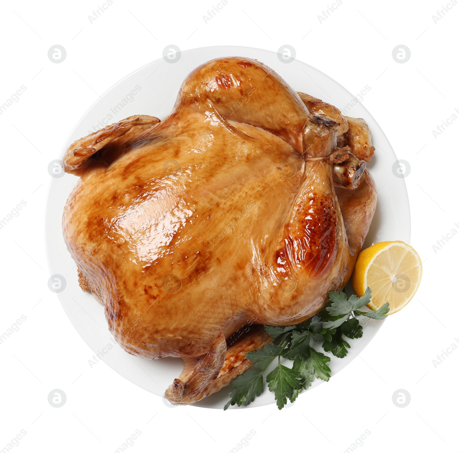 Photo of Tasty roasted chicken with parsley and lemon isolated on white, top view
