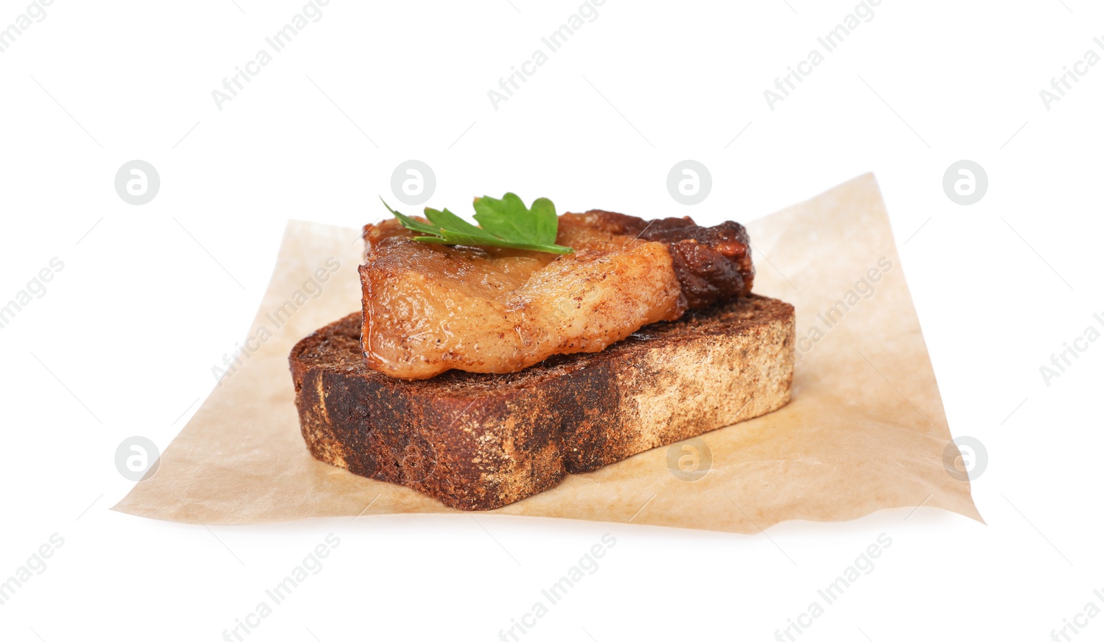 Photo of Rye bread with tasty fried crackling and parsley on white background. Cooked pork lard