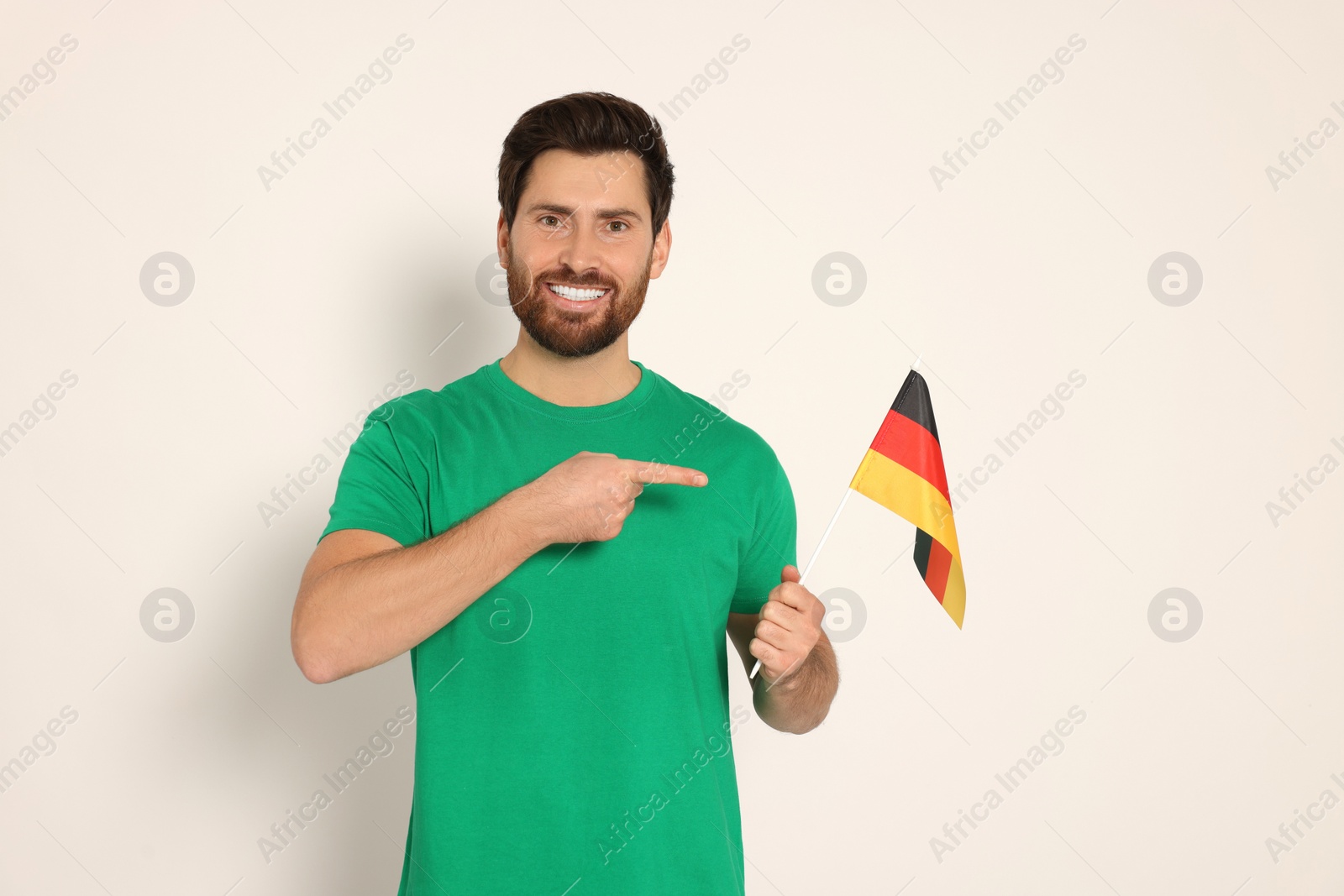 Photo of Man with flag of Germany on white background