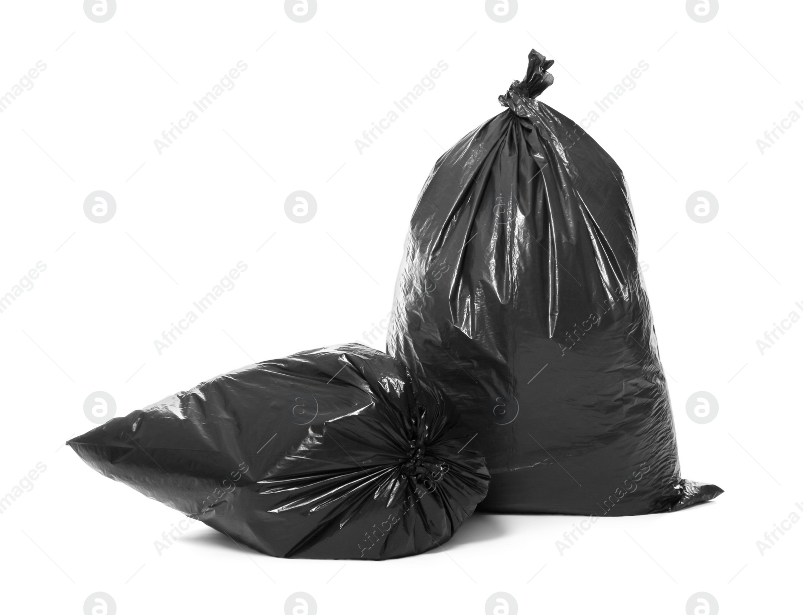 Photo of Trash bags full of garbage isolated on white