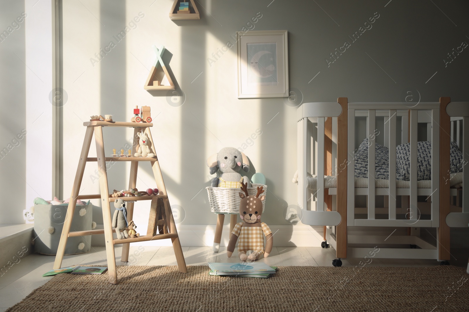 Photo of Beautiful baby room interior with stylish wooden ladder
