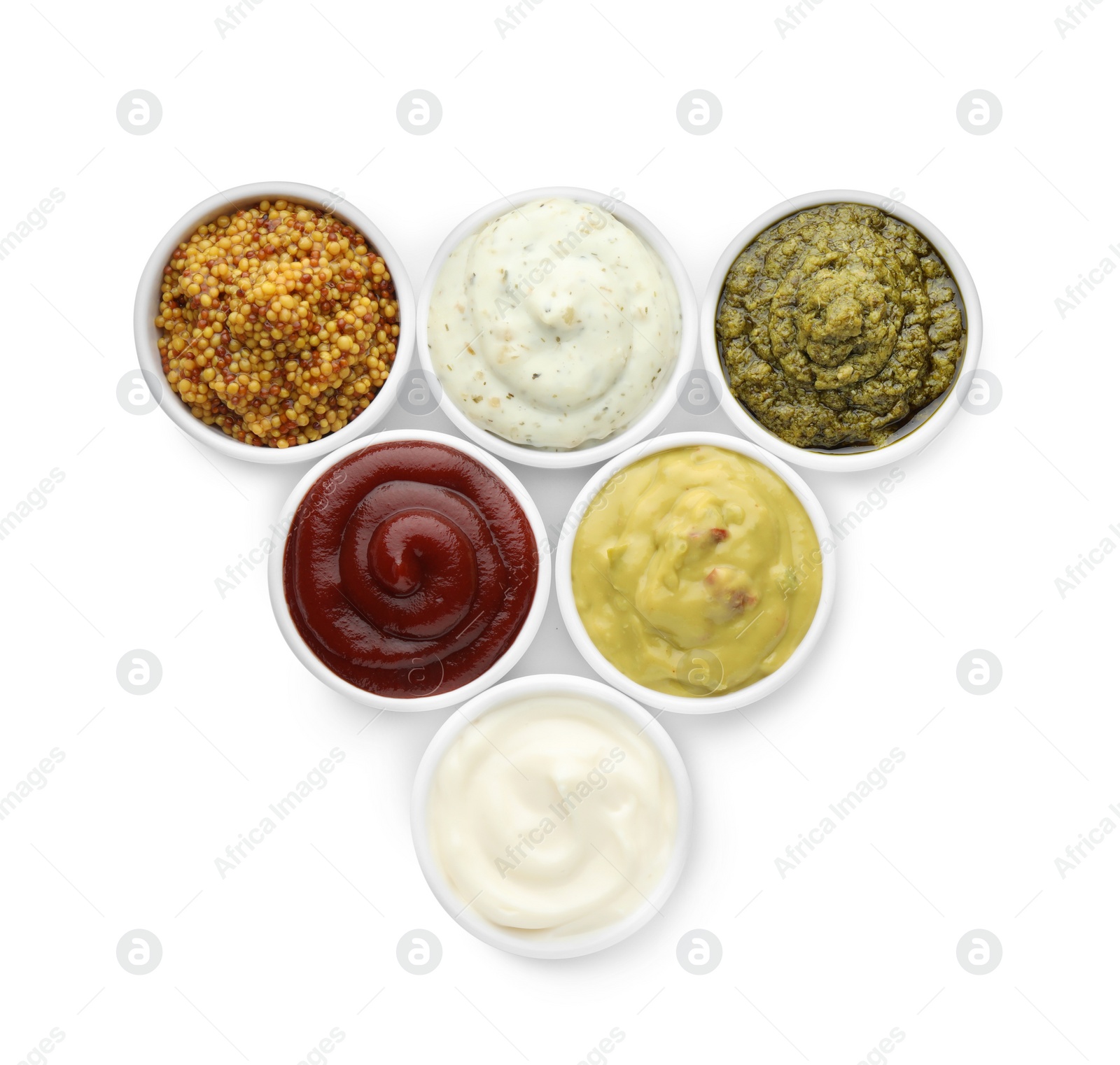 Photo of Many different sauces in bowls on white background, top view