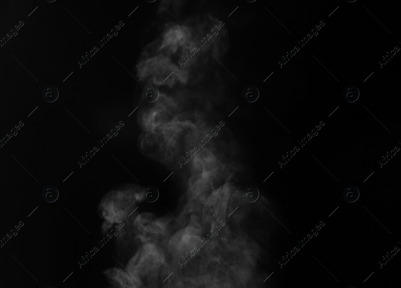 Photo of White steam column rising on black background