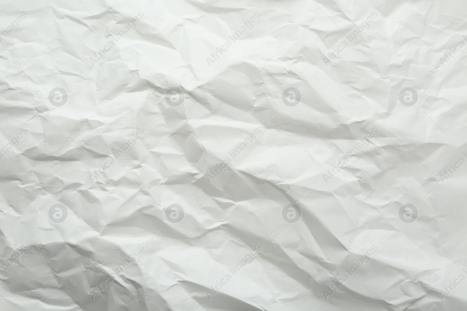 Photo of Crumpled notebook sheet as background, top view