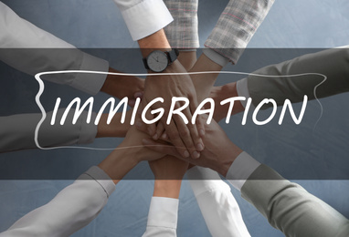 Image of Immigration concept. People holding hands together, top view