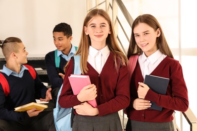 Group of teenagers in school uniform indoors