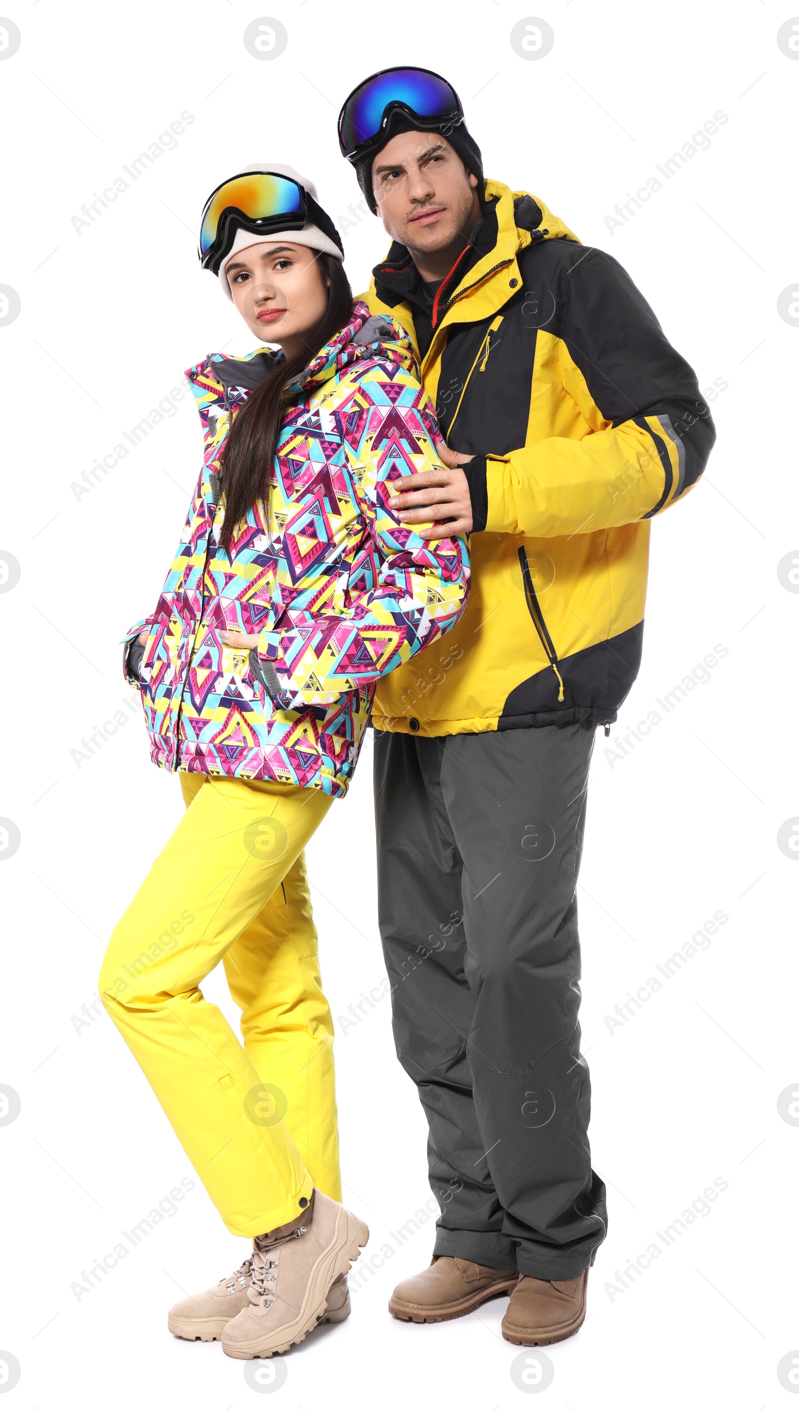 Photo of Couple wearing stylish winter sport clothes on white background