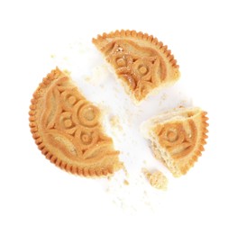 Photo of Broken tasty sandwich cookie with cream on white background, top view