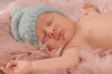 Photo of Cute newborn baby sleeping on fluffy blanket, closeup
