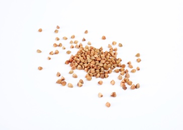 Photo of Uncooked buckwheat on white background. Healthy diet