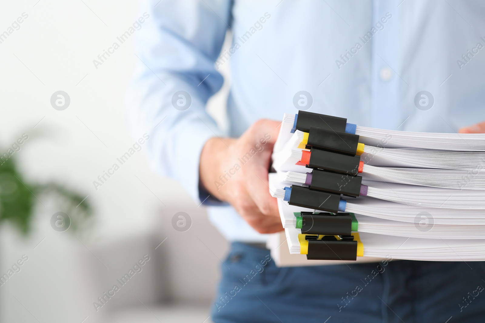 Photo of Businessman with documents in office, closeup. Space for text