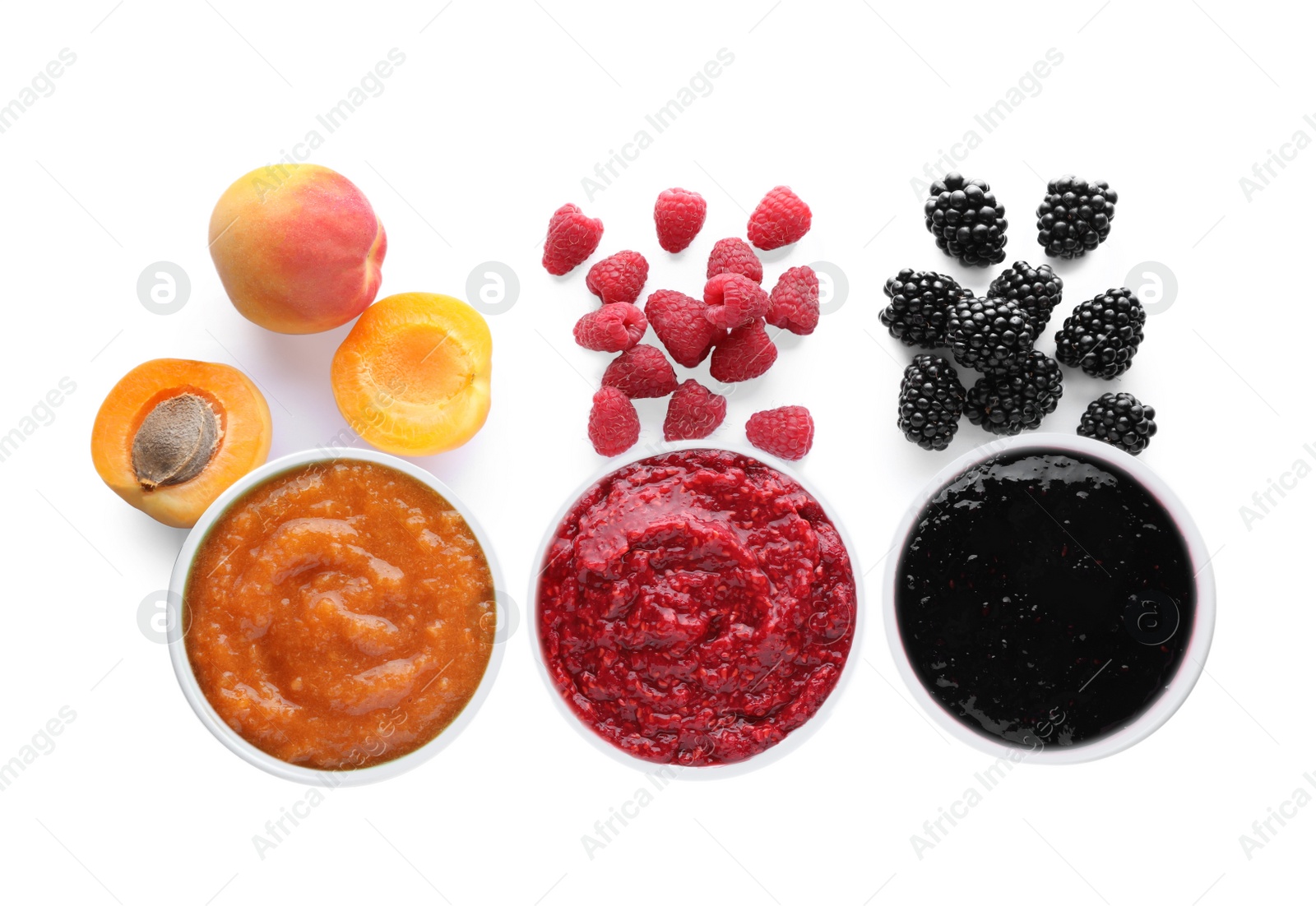 Photo of Different puree in bowls and fresh ingredients on white background, top view