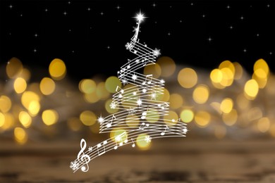 Christmas tree made of music notes and snowflakes on black background. Bokeh effect