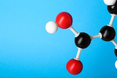 Closeup view of vitamin B3 molecule on light blue background, space for text. Chemical model