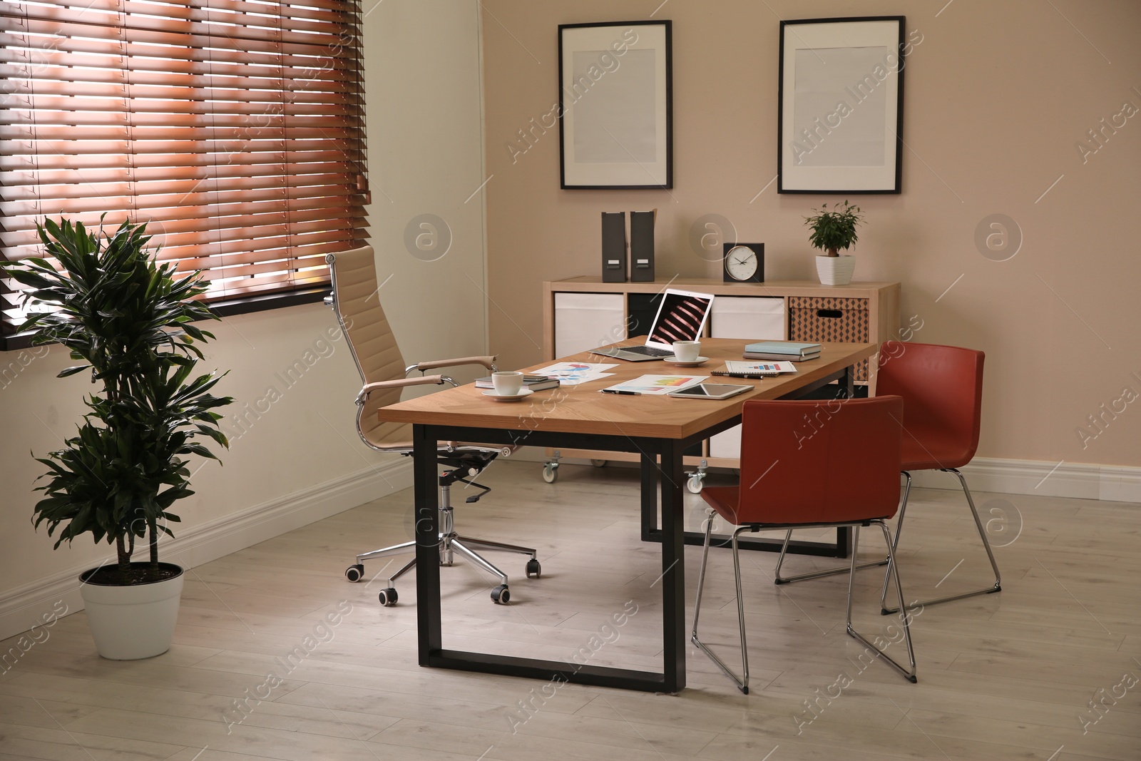 Photo of Director's office with large wooden table. Interior design