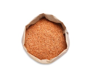Photo of Pink salt with spices in paper bag isolated on white, top view