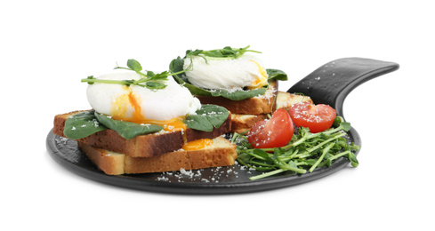 Photo of Delicious poached egg sandwiches with garnish isolated on white