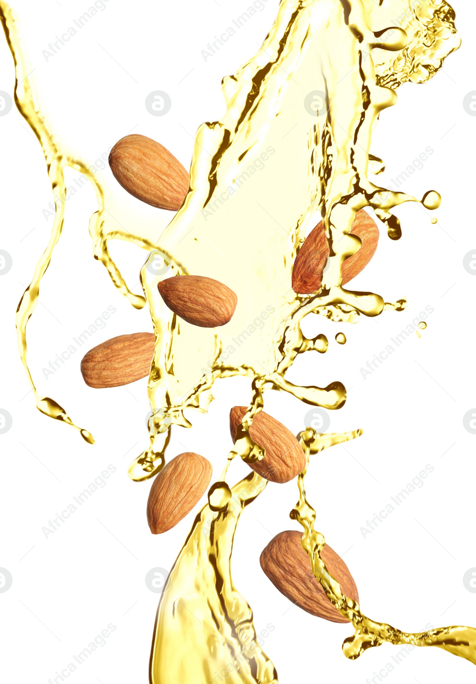 Image of Organic almond oil and tasty nuts flying on white background