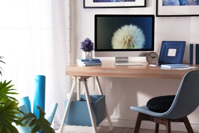 Modern workplace interior with computer on table