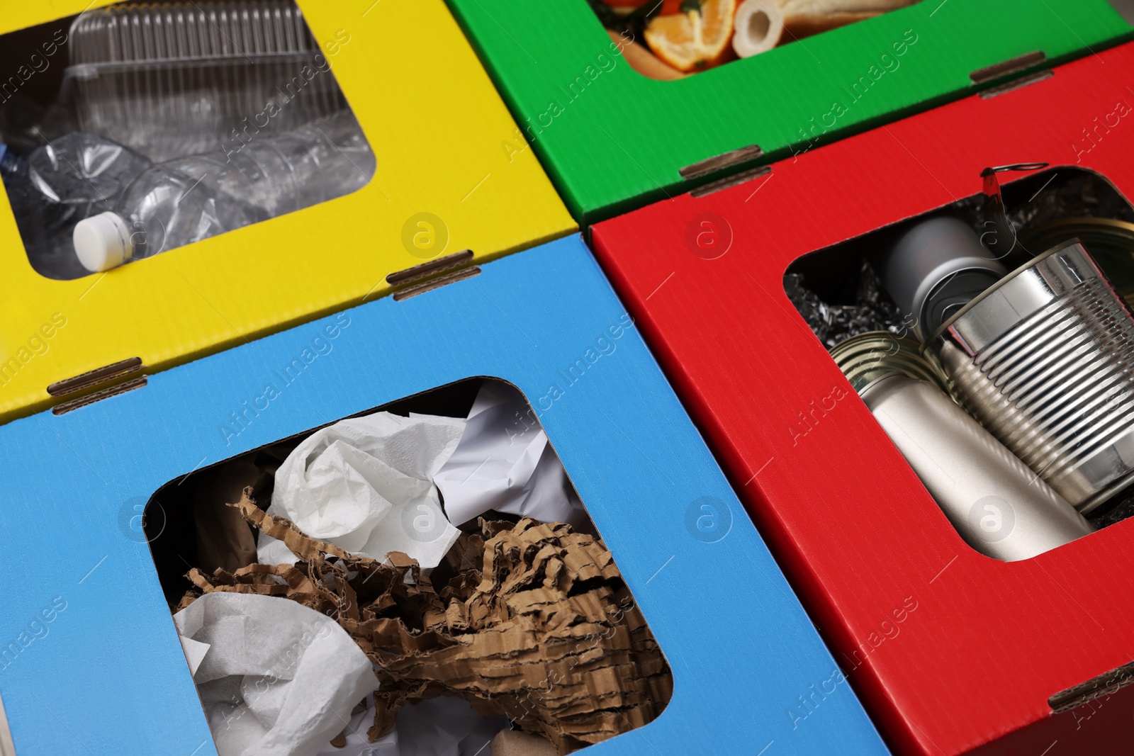 Photo of Garbage sorting. Full trash bins for separate waste collection, closeup view