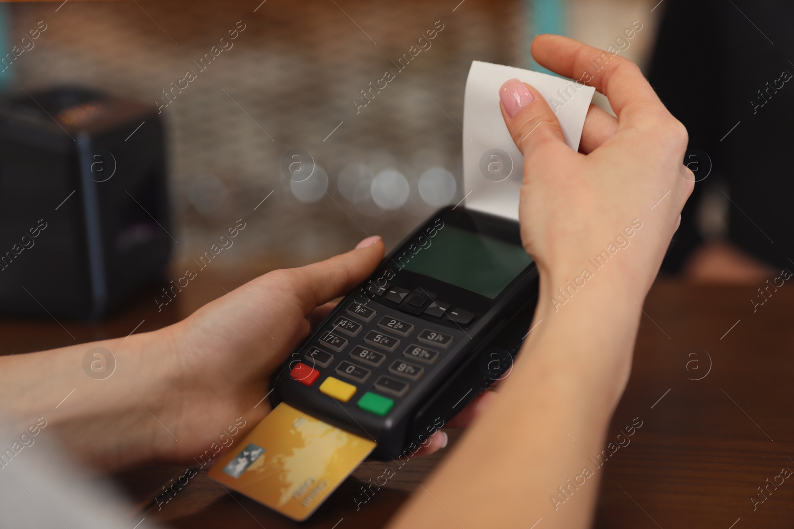 Photo of Woman using credit card machine for non cash payment in cafe, closeup. Space for text