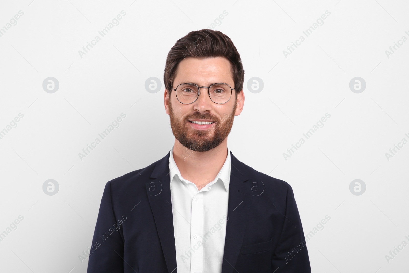 Photo of Portrait of handsome man in glasses on white background