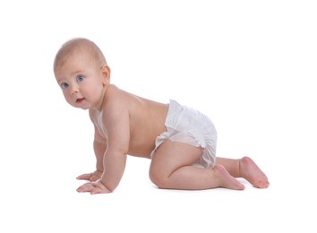 Photo of Cute baby in dry soft diaper crawling on white background