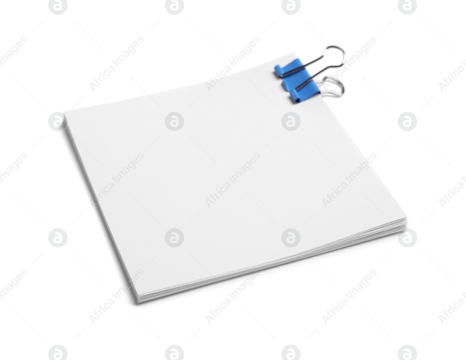 Photo of Note paper sheets with blue clip isolated white