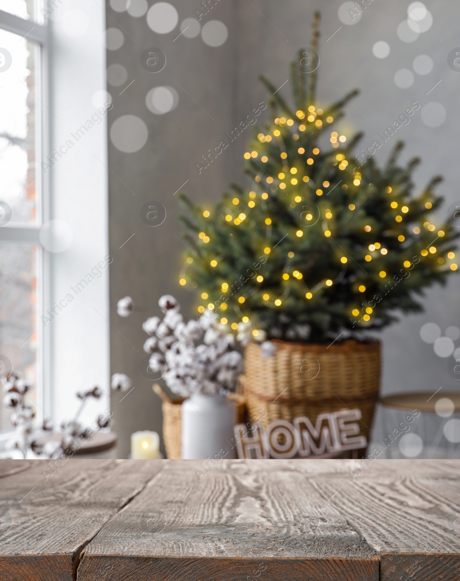 Image of Empty wooden surface and blurred view of room decorated for Christmas