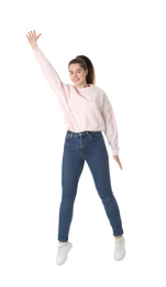 Photo of Happy young woman jumping on white background