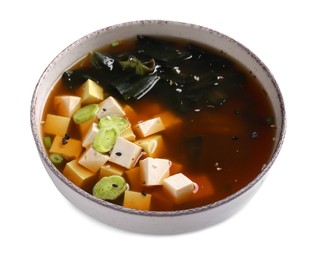 Photo of Bowl of delicious miso soup with tofu isolated on white