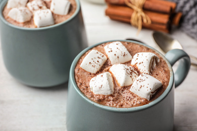 Cup of delicious hot cocoa with marshmallows, closeup