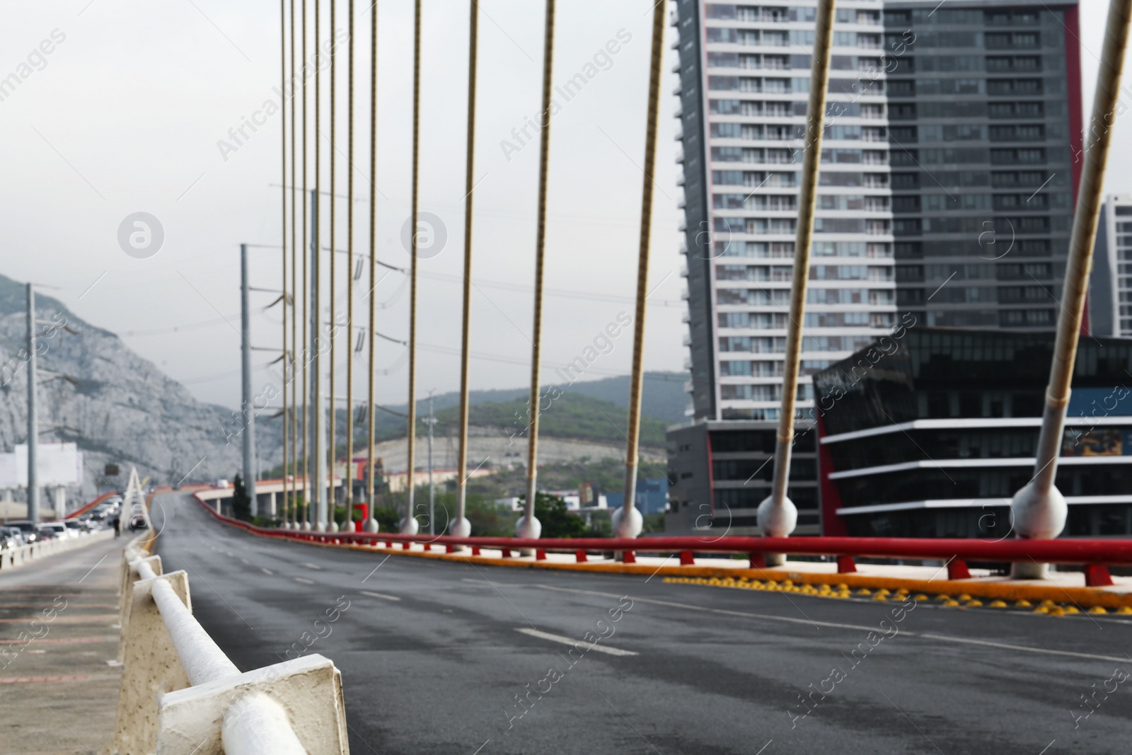 Photo of Blurred view of modern bridge near city