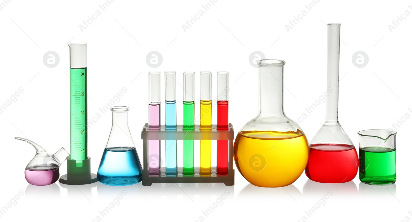 Photo of Laboratory glassware with colorful liquids on white background