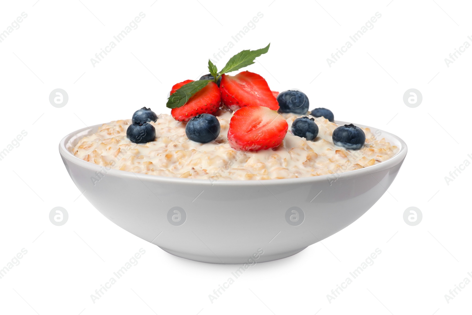 Photo of Tasty boiled oatmeal with berries in bowl isolated on white