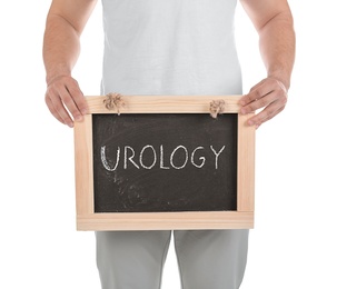 Young man holding chalkboard with word UROLOGY on white background