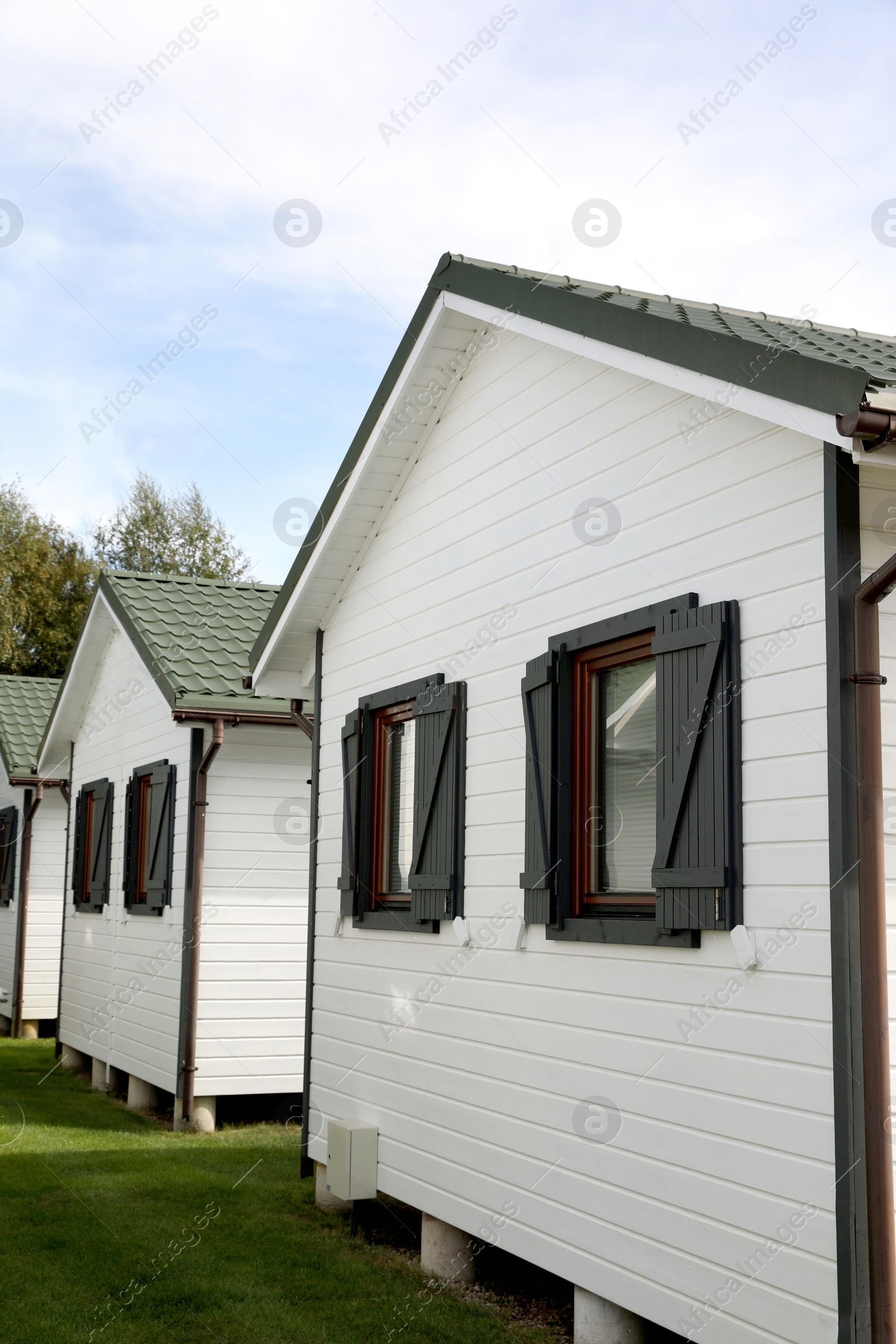 Photo of Exterior of beautiful modern white houses outdoors