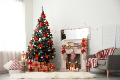 Photo of Blurred view of stylish living room interior with decorated Christmas tree