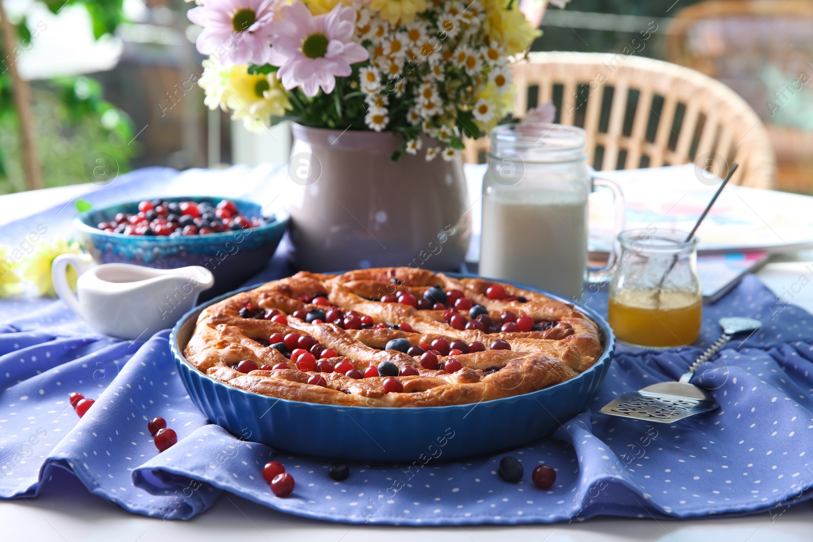 Photo of Delicious currant pie with fresh berries served on white table