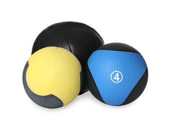 Photo of Different medicine balls on white background. Sport equipment