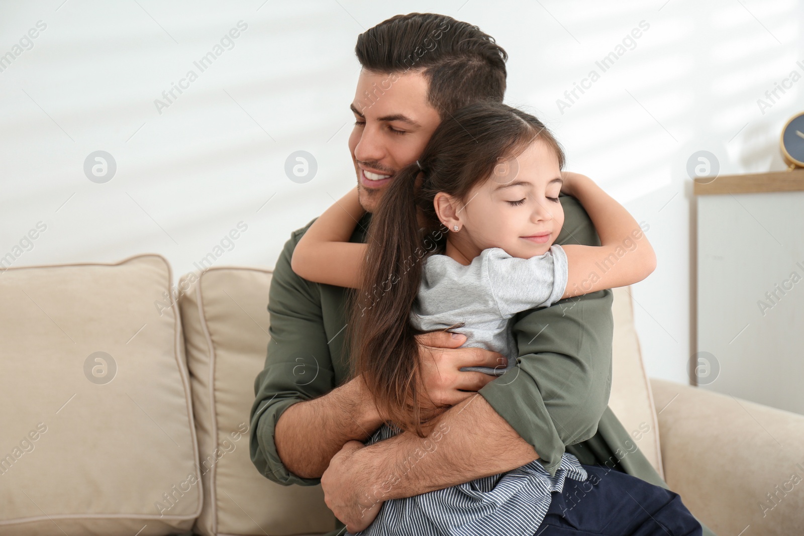 Photo of Dad and daughter spending time together at home. Happy Father's Day