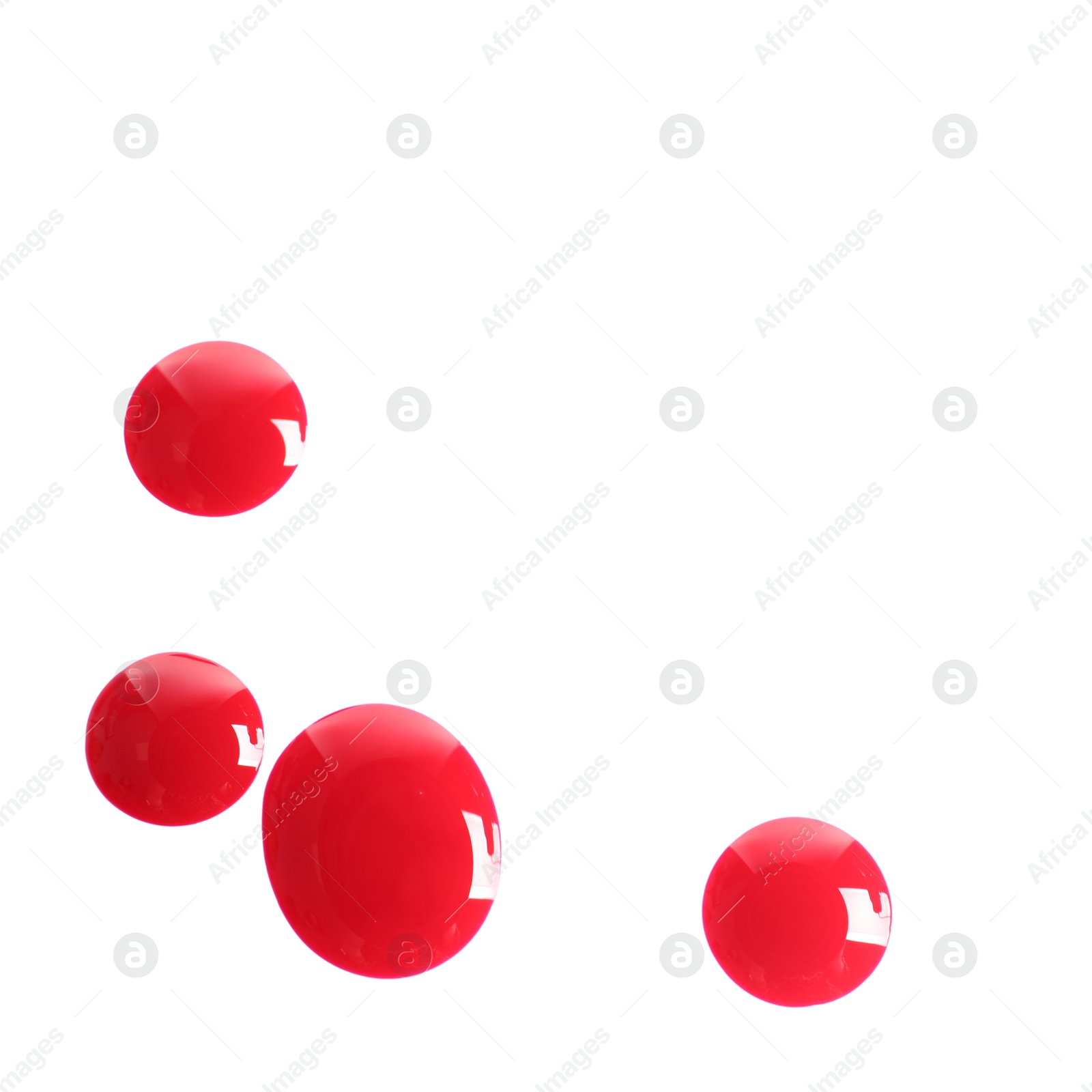 Photo of Red nail polish drops on white background, top view